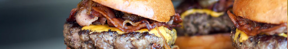 Eating American (Traditional) Burger at Sylvester's Burgers restaurant in Oceano, CA.